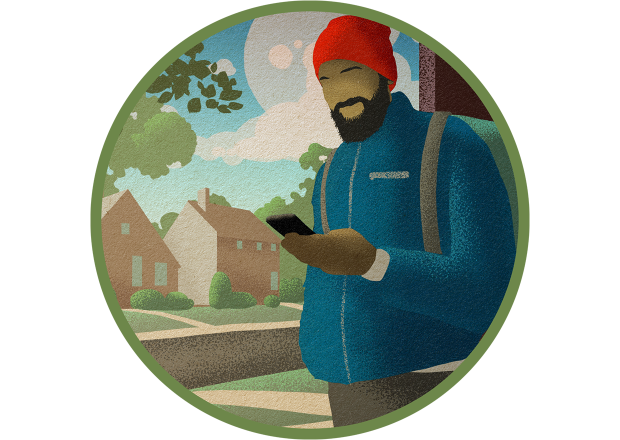 A man in a red hat, blue jacket and backpack checks his phone for important updates before he leaves for an outdoor activity.