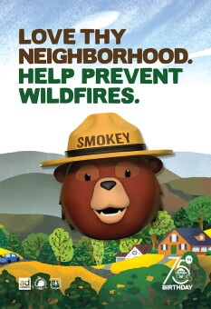 Cartel que dice: "Quiere a tu vecindario. Ayuda a prevenir los incendios forestales".