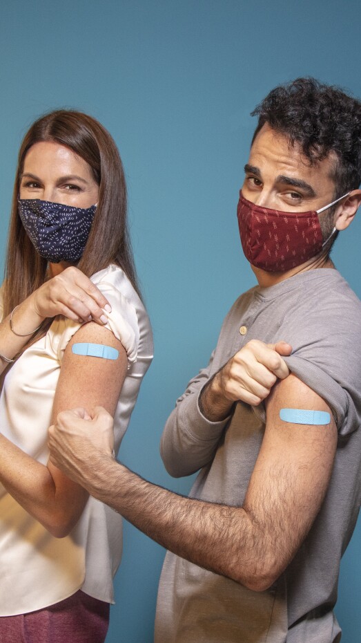 family smiling after receiving their flu shot